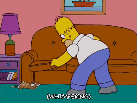 Homer Simpson missing something and searching through his couch
